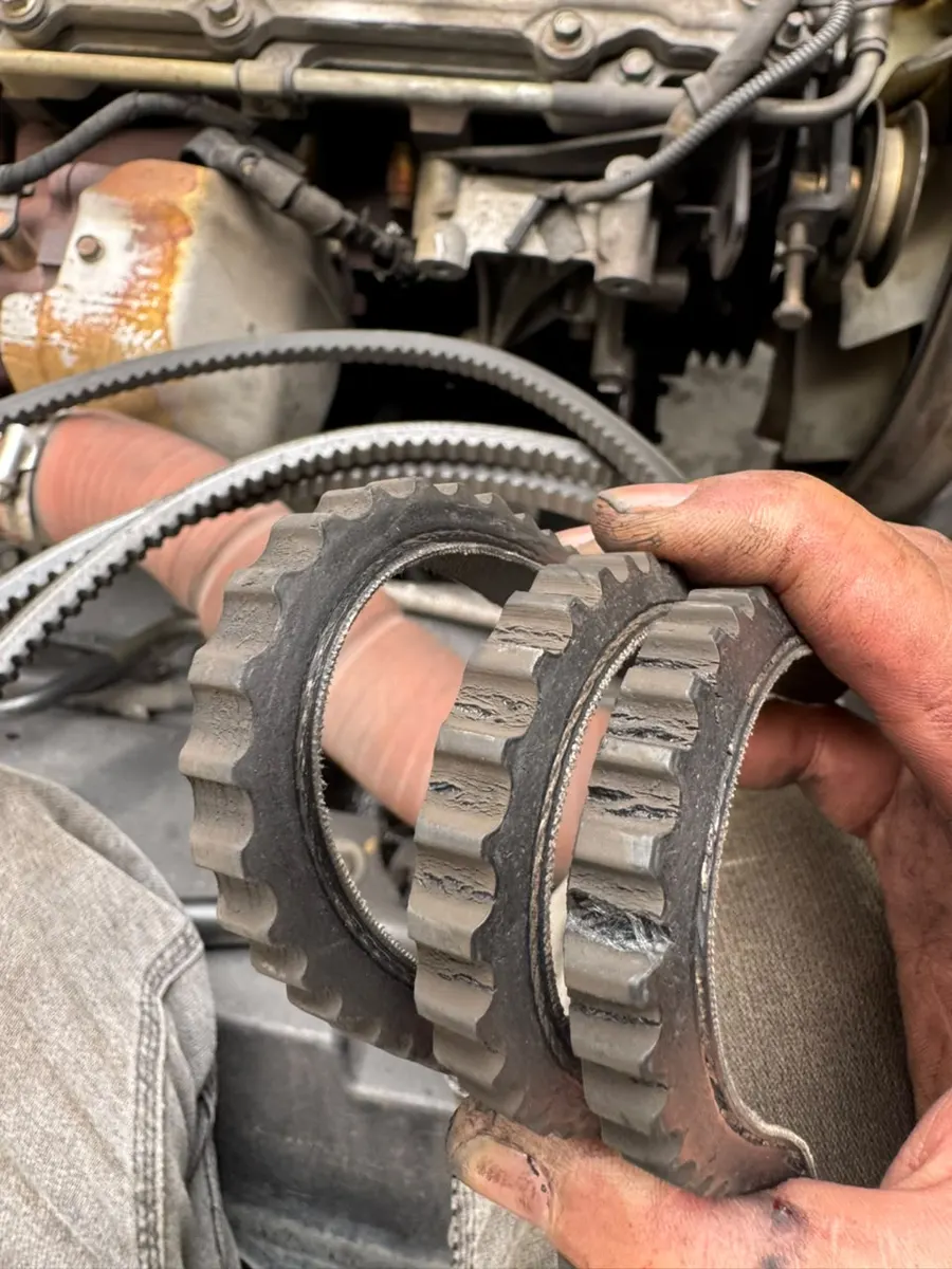Worn-out fan belt taken off a car engine