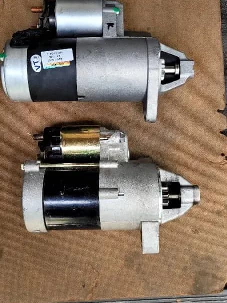 Old and new starter motor side by side