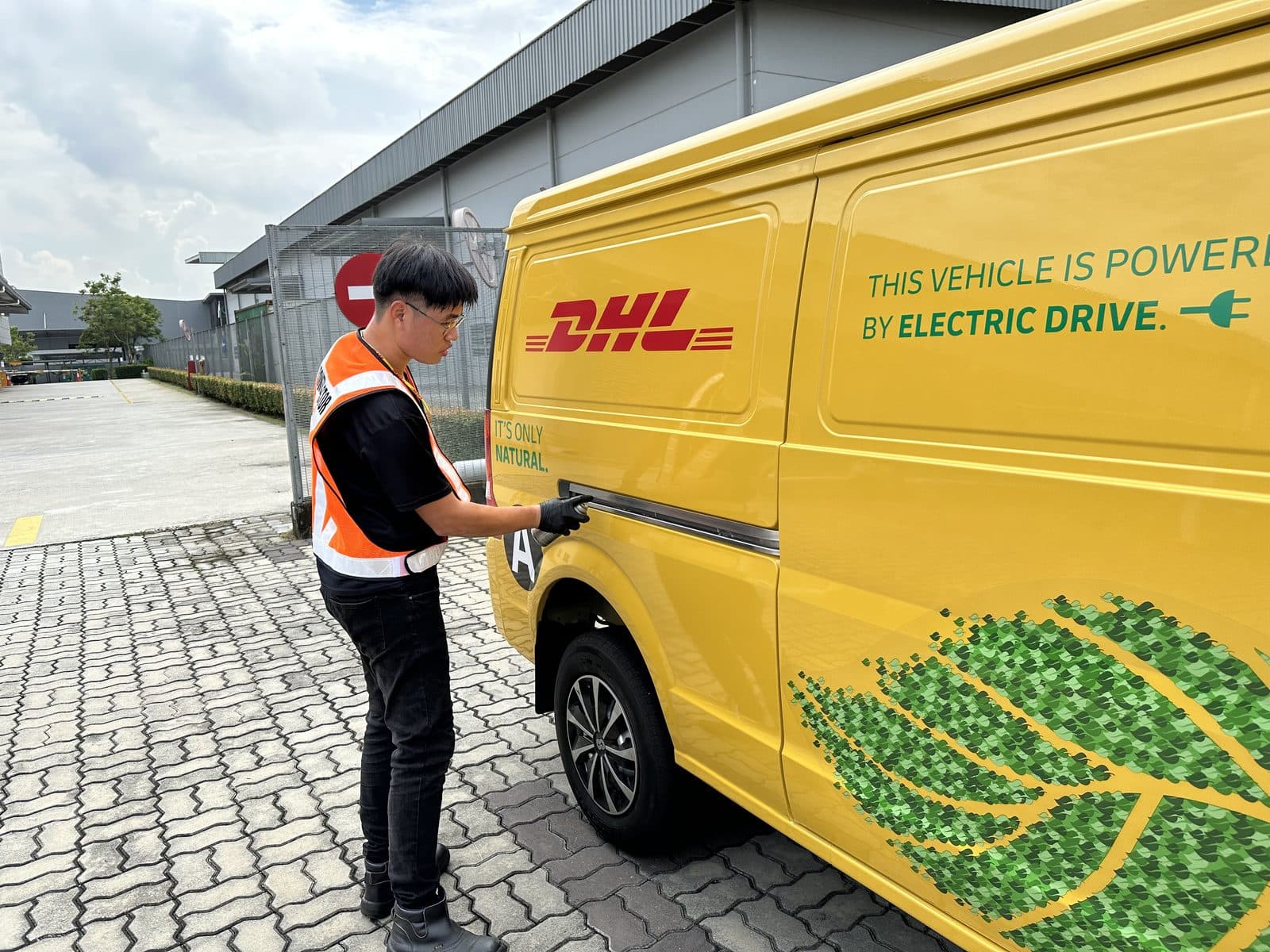 CarShifu technician servicing a branded delivery van at a depot during a fleet maintenance contract in KL