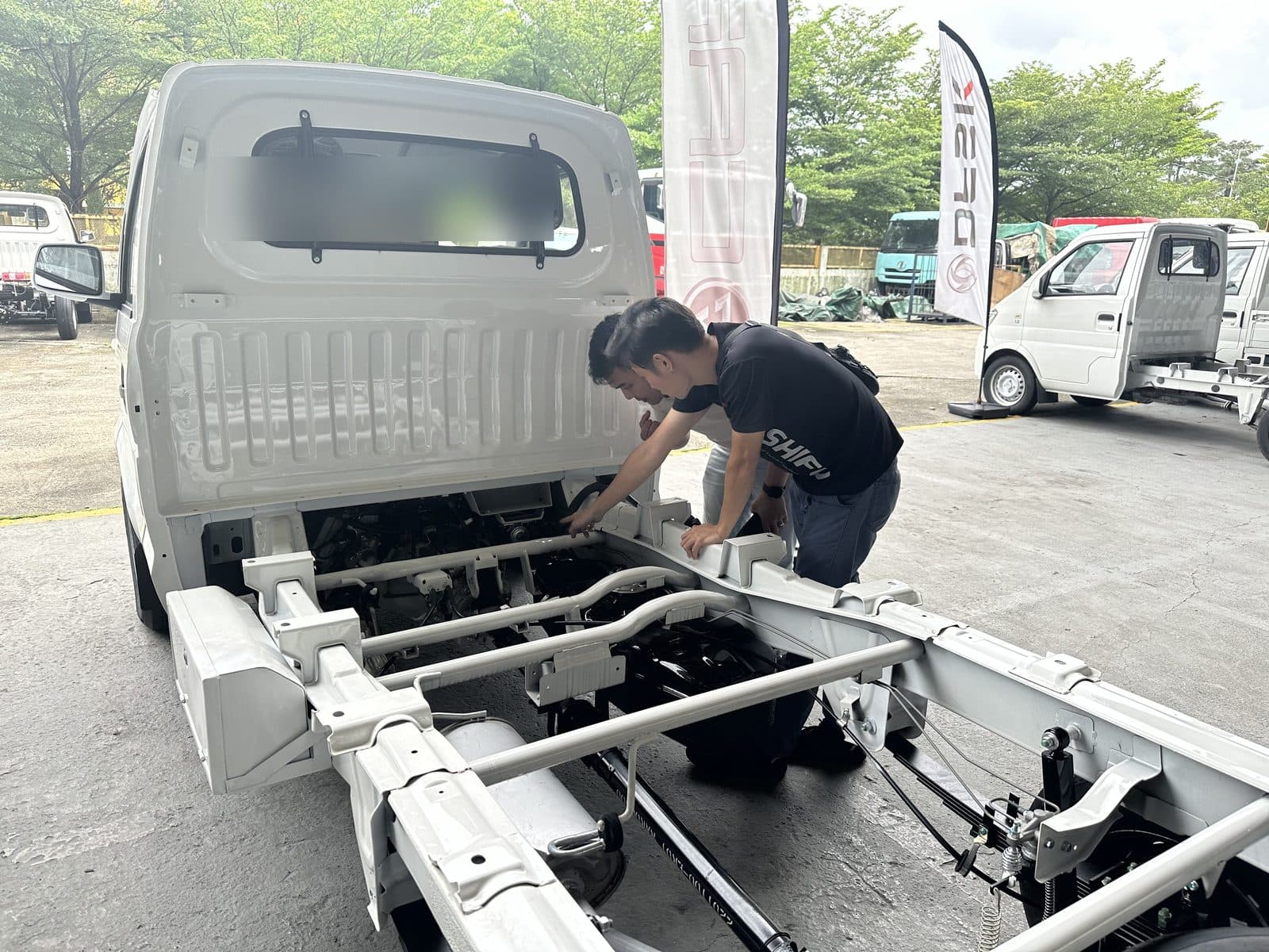CarShifu technician working on a bare lorry chassis frame during a commercial vehicle repair in KL