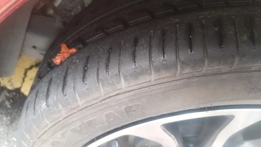Car tyre after a puncture plug repair